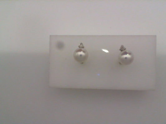 Pearl and diamond stud earrings.