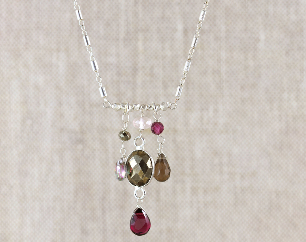 Sterling silver necklace with colorful gemstones.