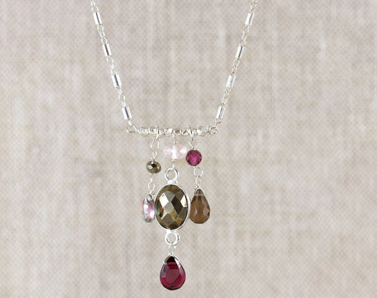 Sterling silver necklace with colorful gemstones.