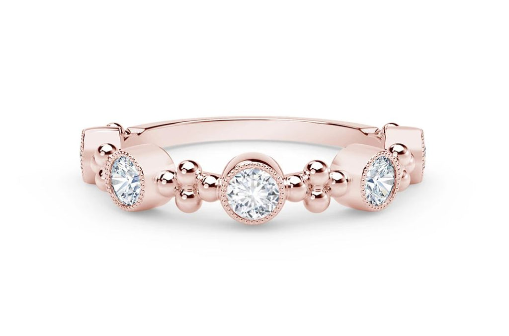 Rose gold ring with round diamonds.