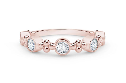 Rose gold ring with round diamonds.
