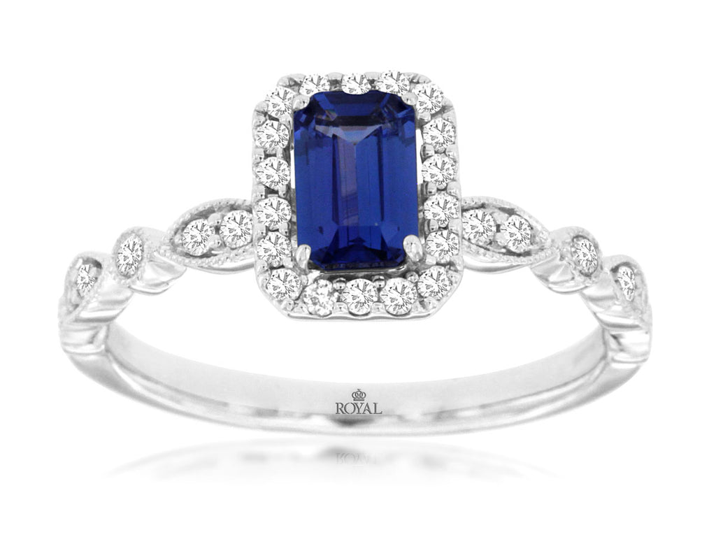 Emerald-cut tanzanite ring with diamond accents.