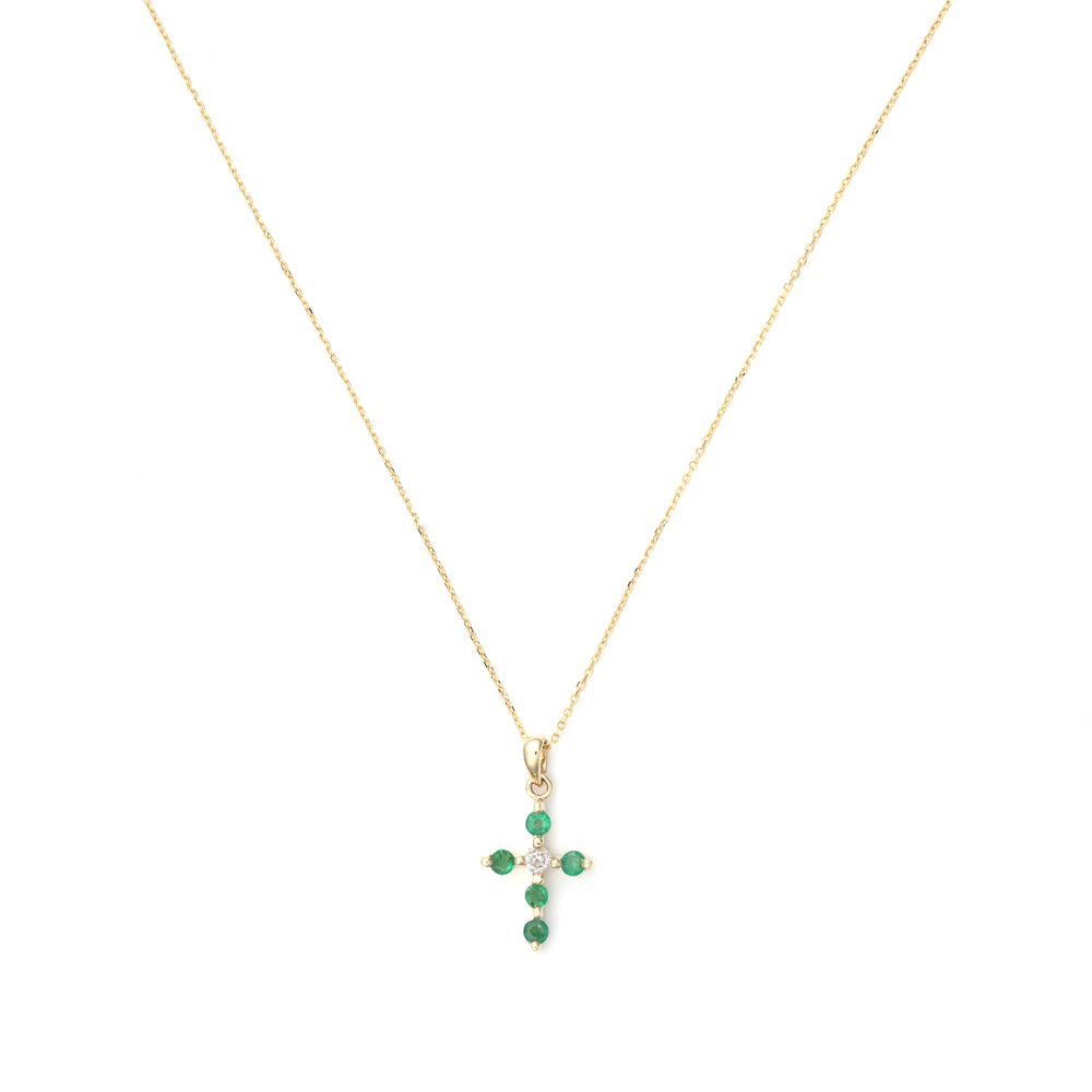 Emerald cross necklace in yellow gold.