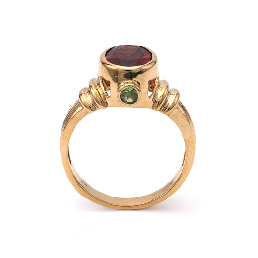 14K gold ring with oval Rhodolite Garnet.