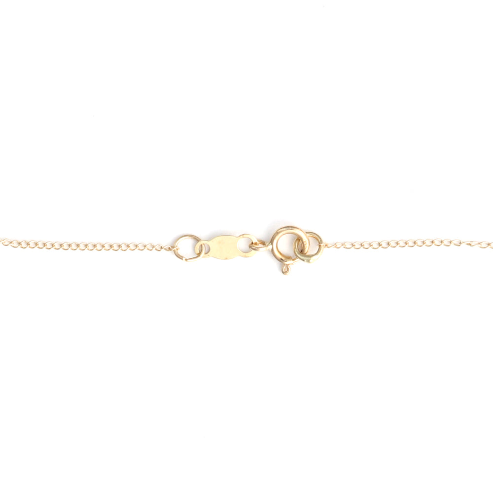 14K yellow gold necklace clasp detail.