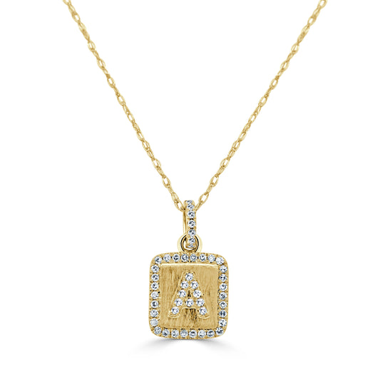 Gold initial pendant with diamond accents.
