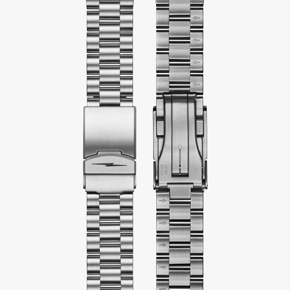 Stainless steel watch bracelet clasp detail.