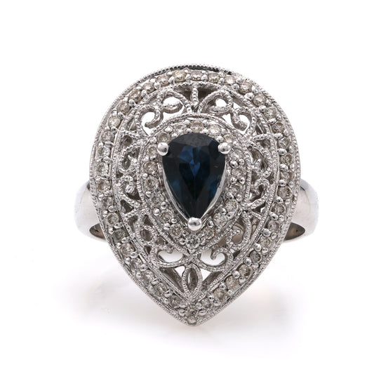 Pear-shaped sapphire ring with intricate diamond setting.