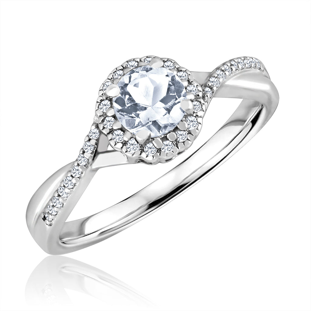 Sterling silver ring with round white topaz.