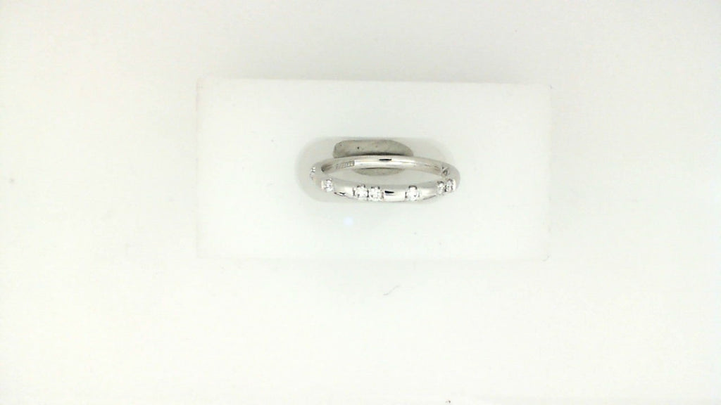 14K white gold band with round diamonds.