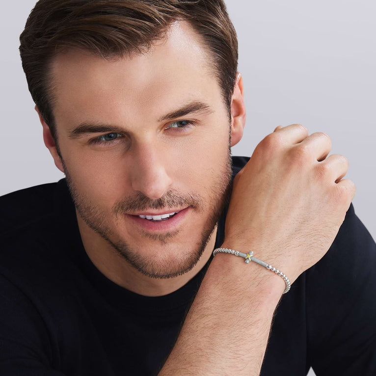 Sterling silver stretch bracelet with gold accents.