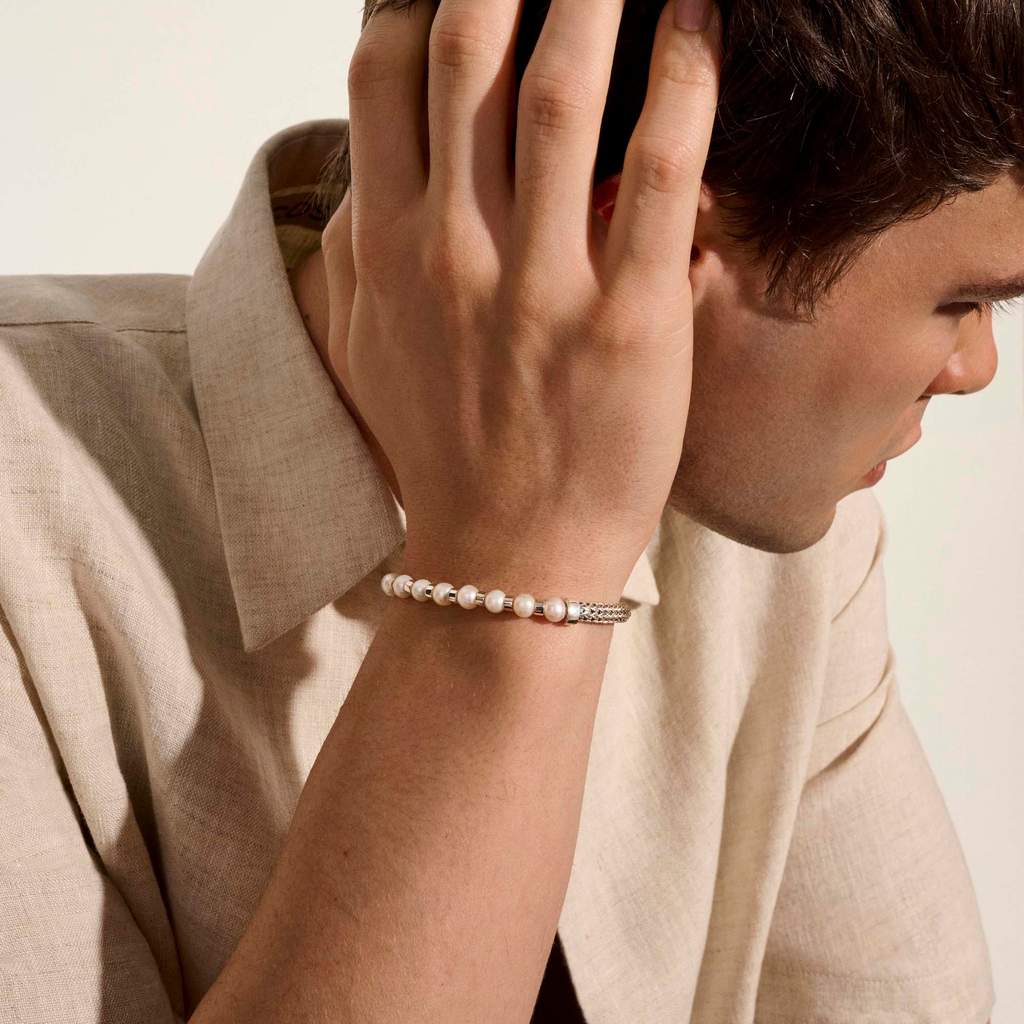 Sterling silver bracelet with cultured pearls.