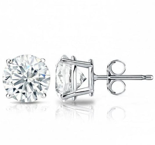 Round diamond studs in white gold setting.