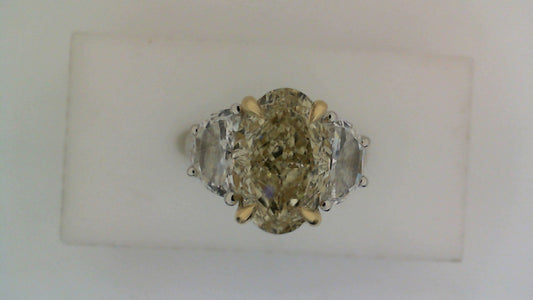 Three-stone yellow diamond engagement ring.