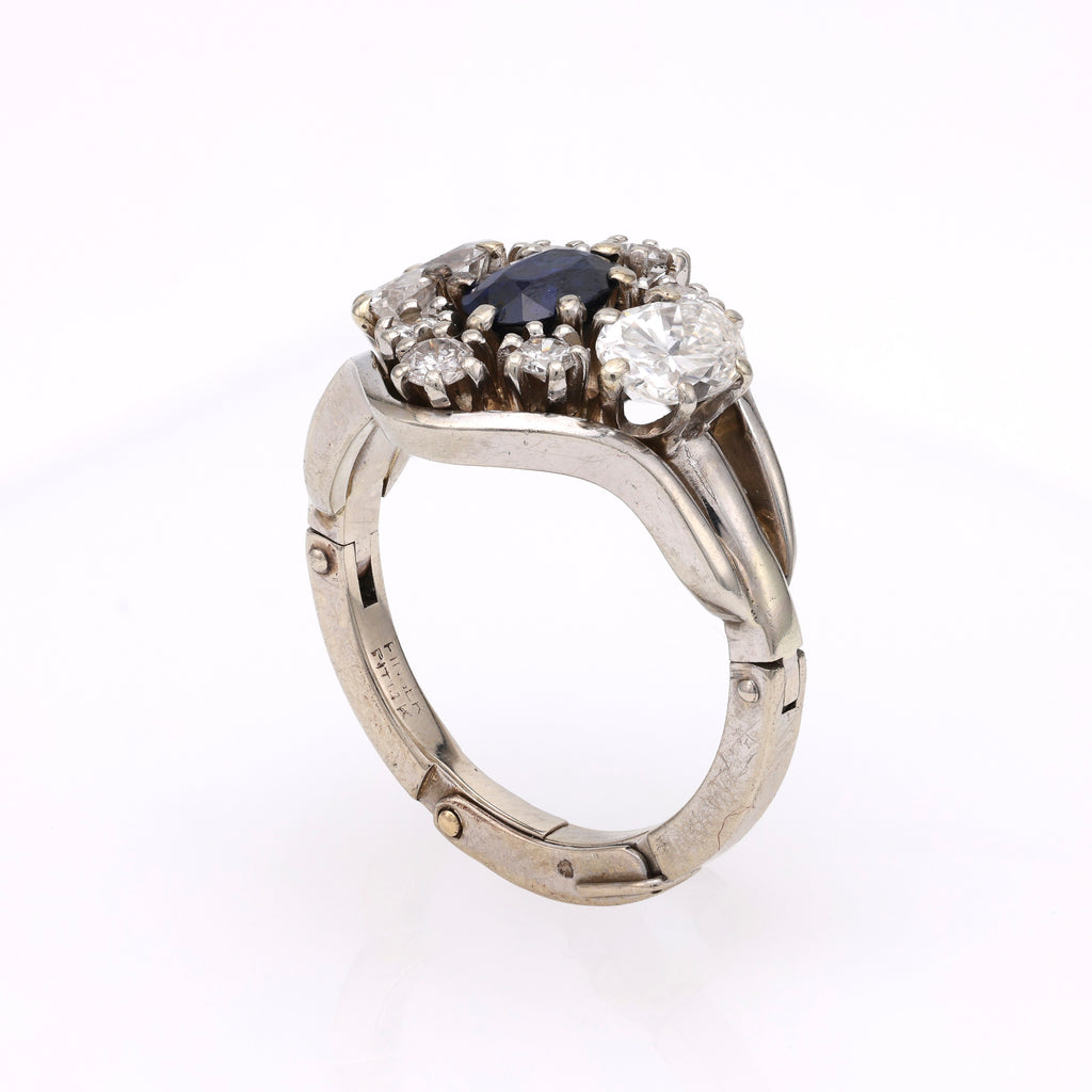 Violetish blue sapphire ring with diamonds.