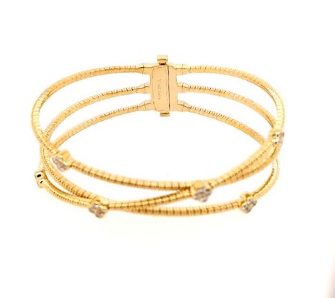 Yellow gold bangle with round diamonds.