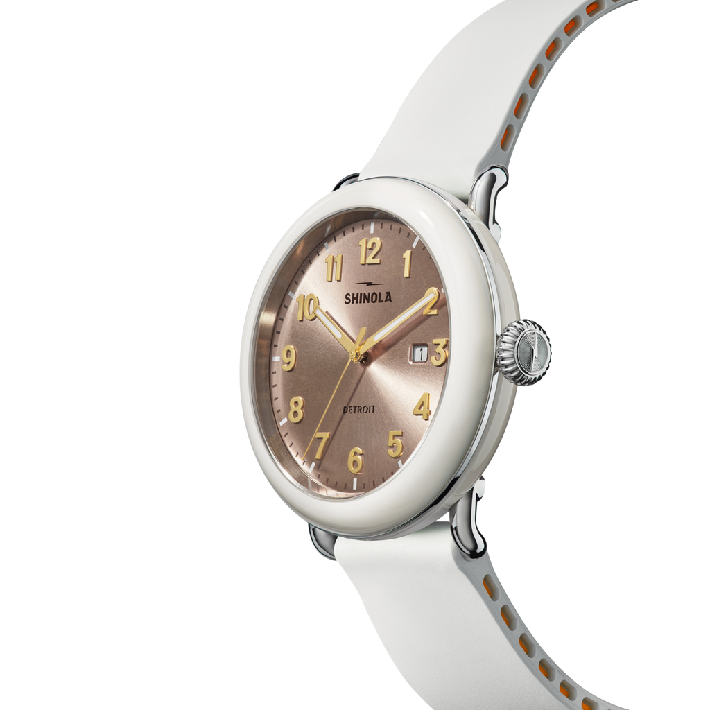 Rose dial, stainless steel case, white rubber band.