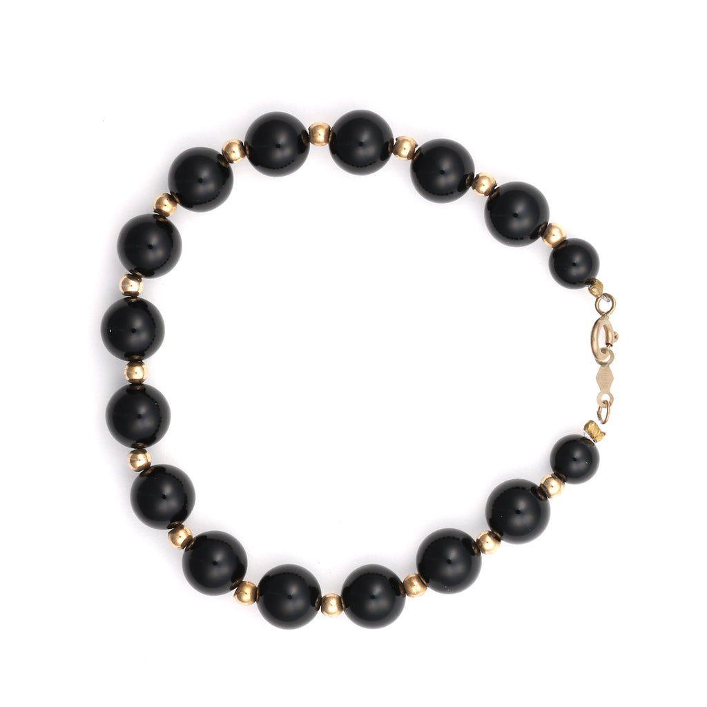 14K gold bracelet with round onyx beads.