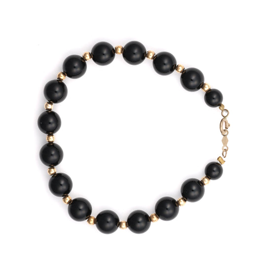 14K gold bracelet with round onyx beads.