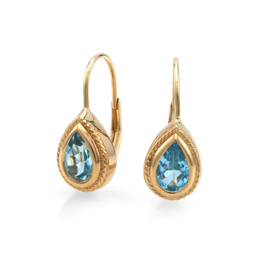 Pear-shaped blue topaz gold earrings.