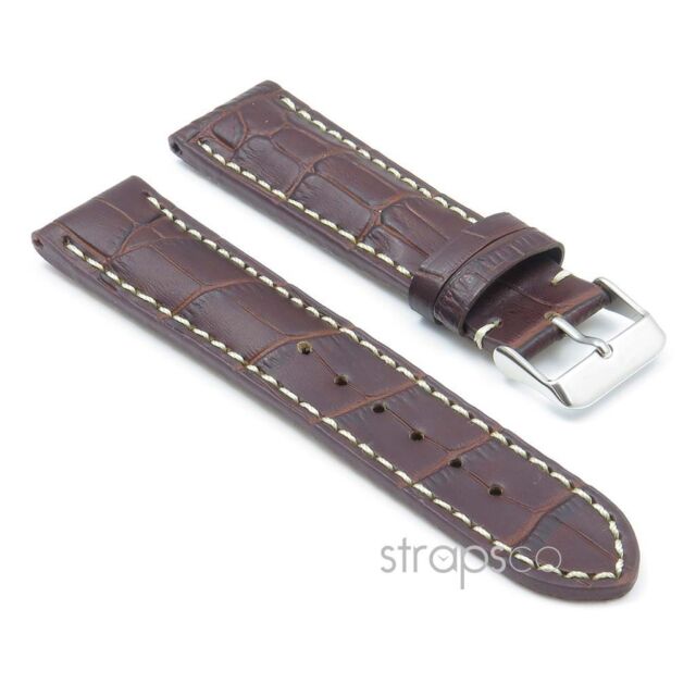 Dark brown leather watch band with buckle.