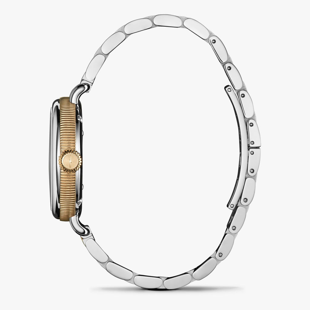 Stainless steel watch with gold crown.