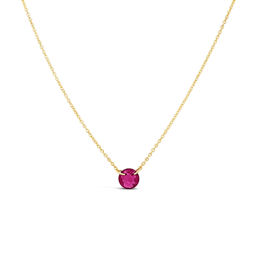 Gold-filled necklace with round ruby pendant.