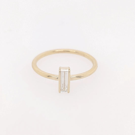 14K yellow gold ring with baguette diamond.