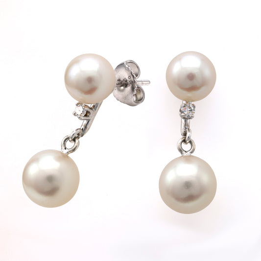 Akoya pearl drop earrings with diamonds.