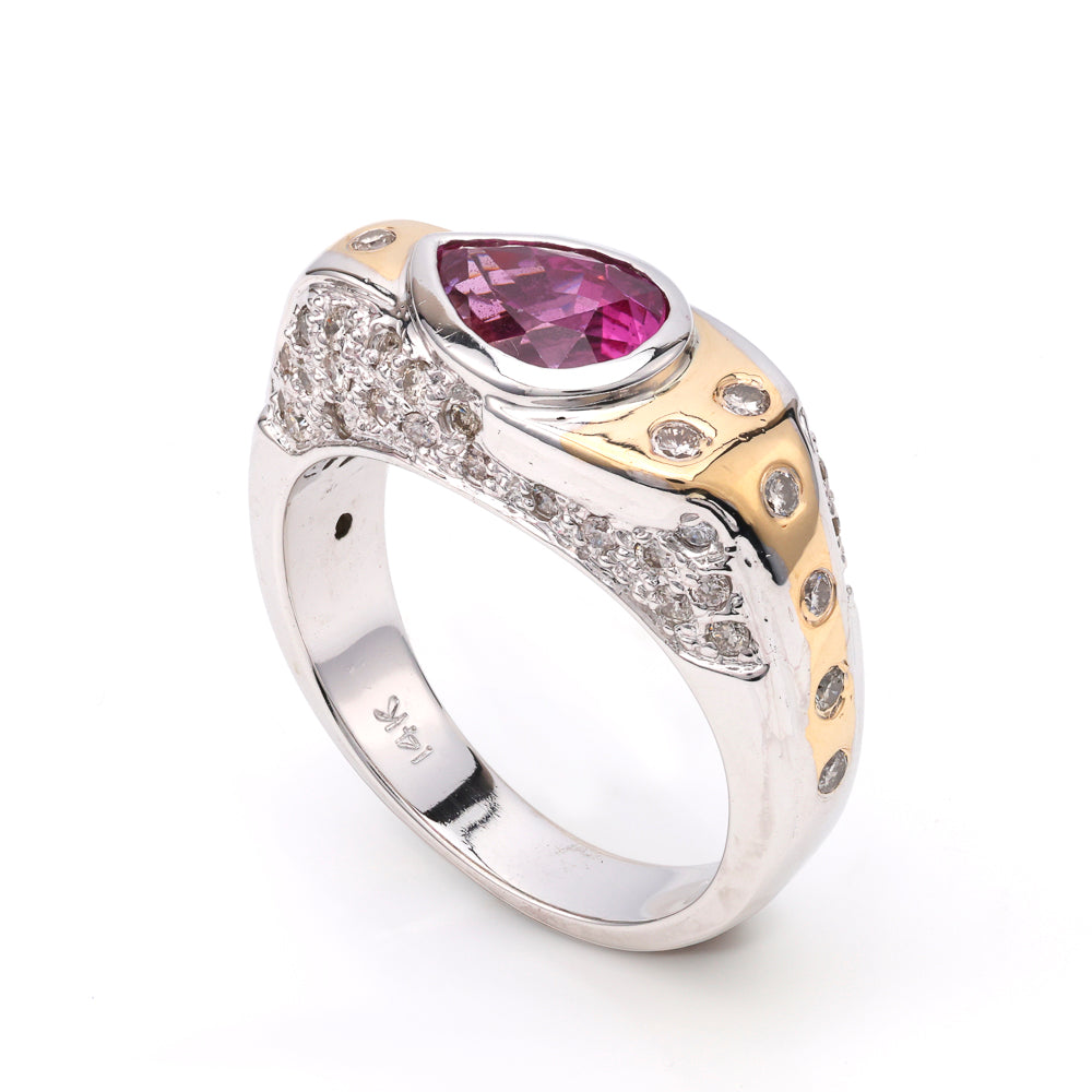 Pear-shaped pink sapphire ring with diamonds.