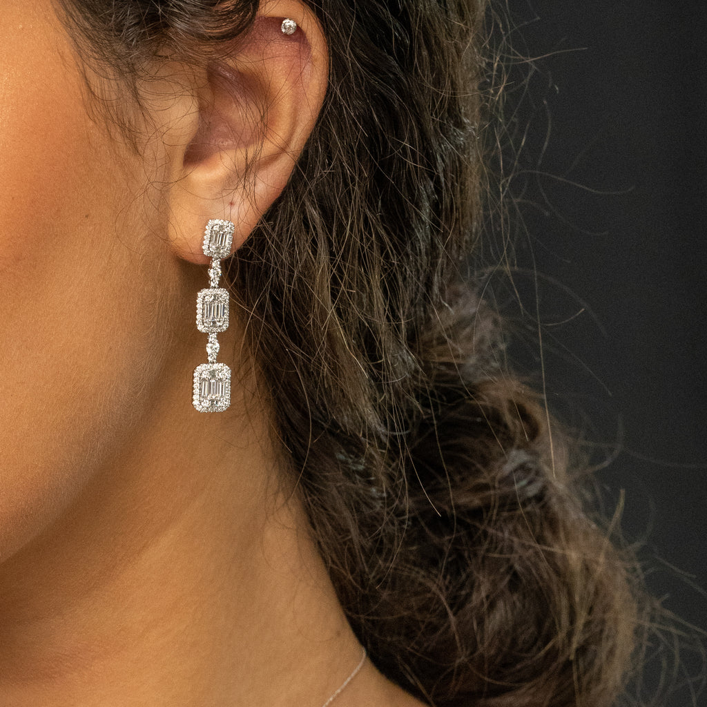 Drop earrings with rectangular diamonds.