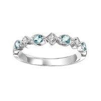 10K white gold band with aquamarines.