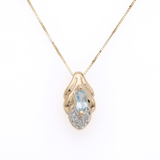 Marquise aquamarine pendant in yellow gold.