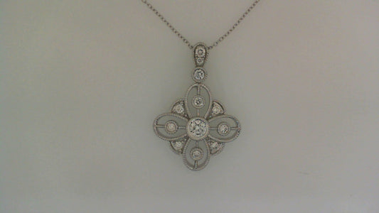 Diamond necklace with intricate floral design.
