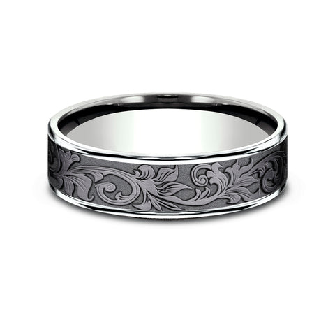 Tantalum carved band with intricate engravings.