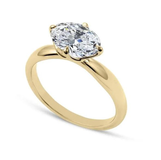 Oval diamond yellow gold engagement ring.