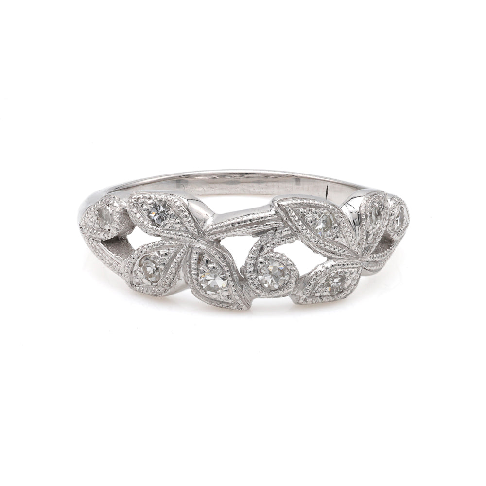 Platinum ring with leaf diamond design.