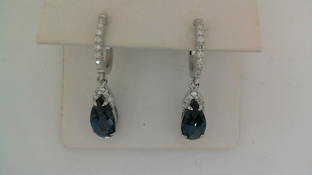 Pear-shaped blue topaz earrings with diamonds.