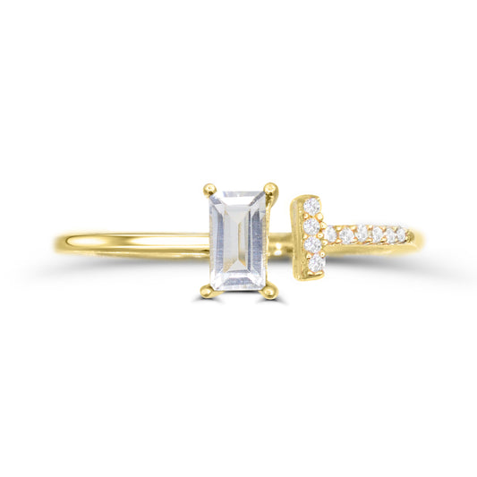 Yellow gold ring with baguette white topaz.
