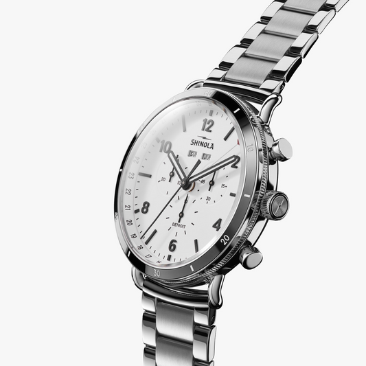 Stainless steel watch with white dial.