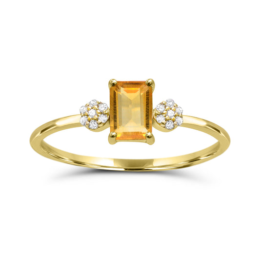 Yellow gold ring with emerald citrine centerpiece.