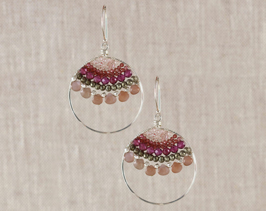 Sterling silver dangle earrings with gemstones.