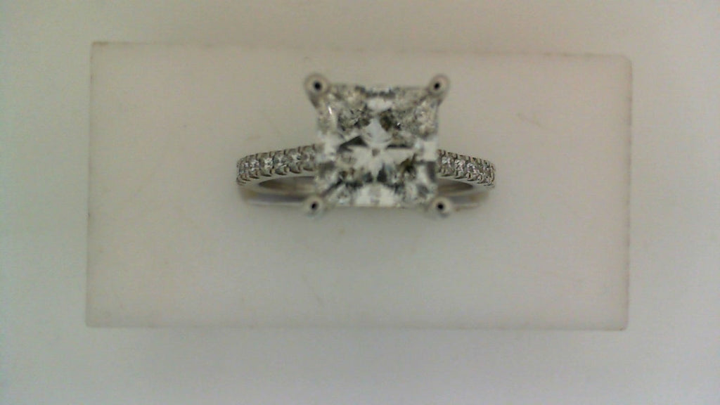 Princess diamond ring with side stone accents.