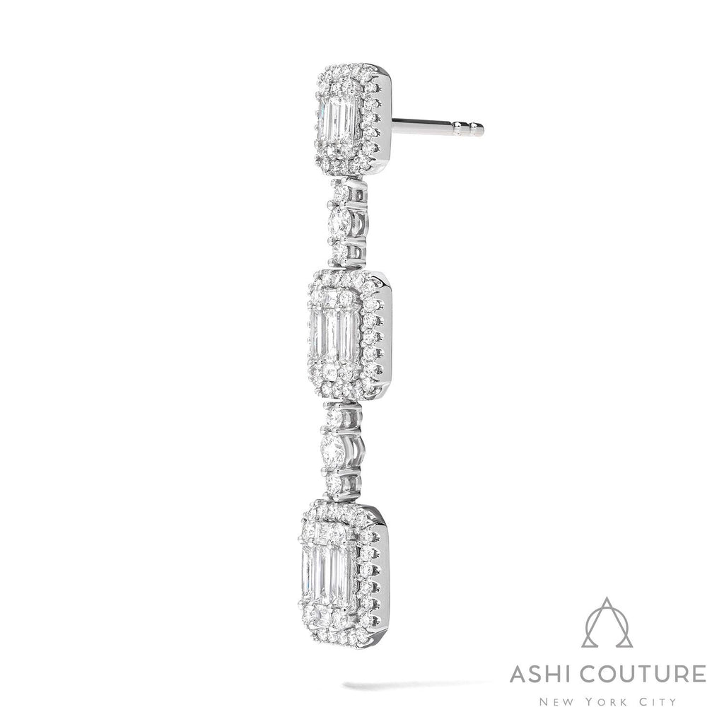 Diamond drop earrings with rectangular clusters.