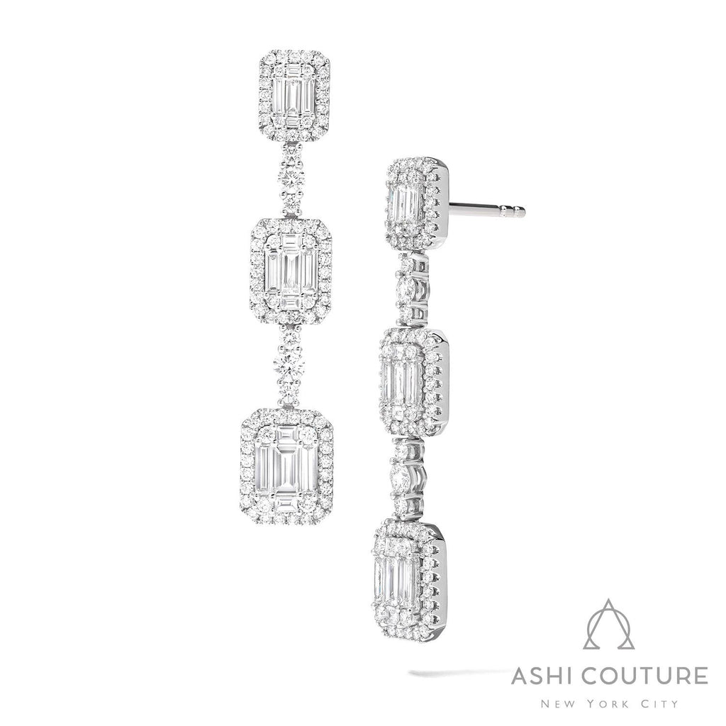 Diamond drop earrings with rectangular clusters.