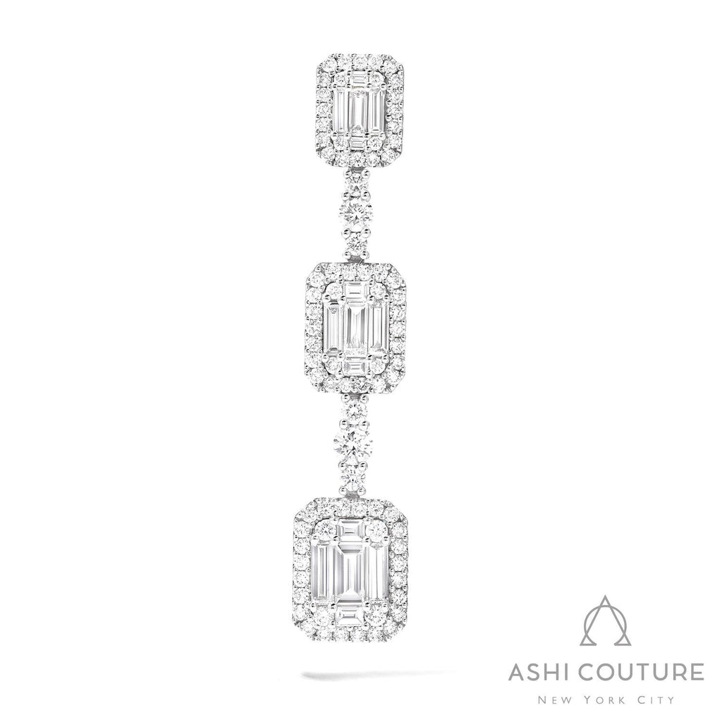 Diamond drop earrings with rectangular clusters.