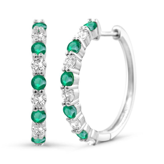 Sterling silver hoops with green gemstones.