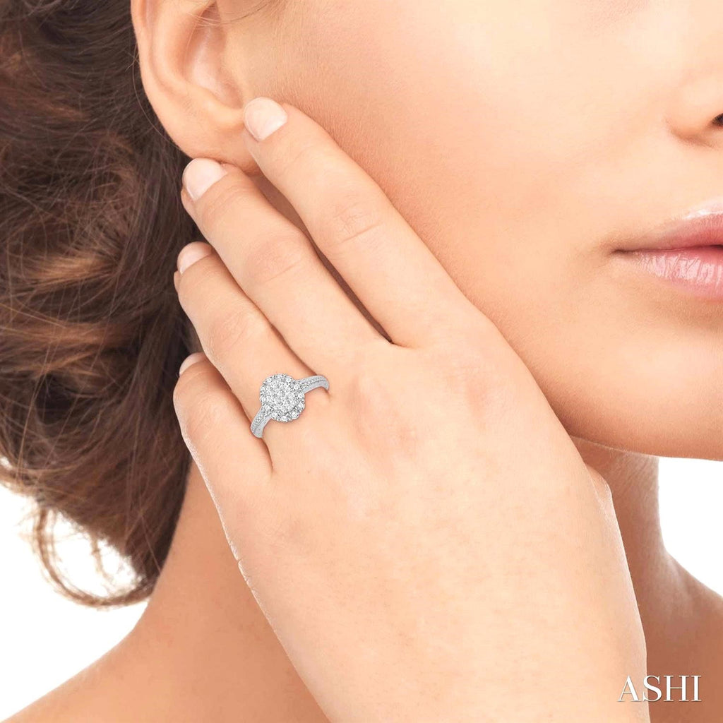 14K white gold diamond cluster ring.