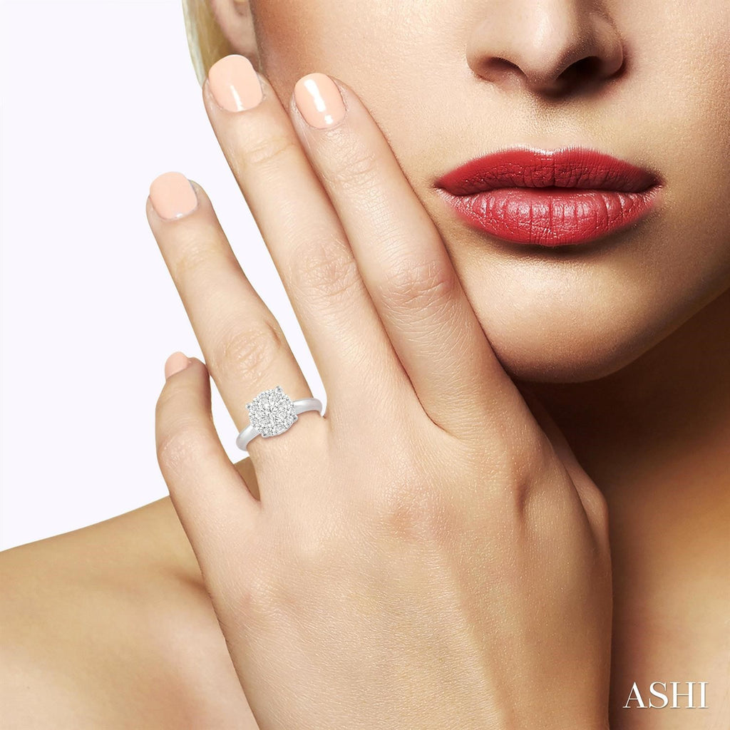 Solitaire diamond ring on hand.