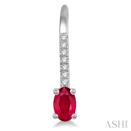 Oval ruby earring with diamond accents.